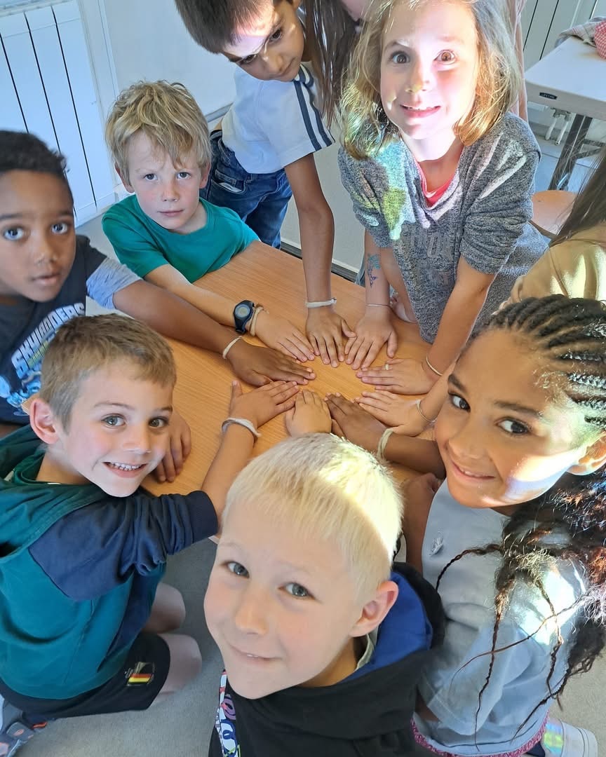 A render of three white cylindrical columns, against a warm creme background
